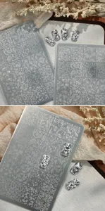 Close-up of TG-018 nail stamping plate featuring intricate floral and vine patterns