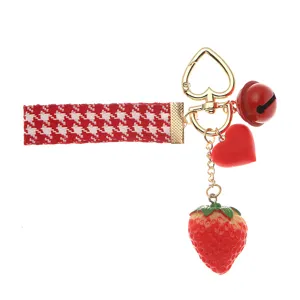 Cute strawberry keychain with red houndstooth strap and heart clasp charm
