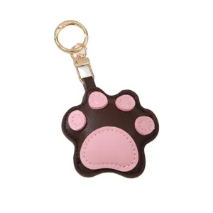 Cute leather cat paw keychain featuring pink pads and a gold-colored metal clasp