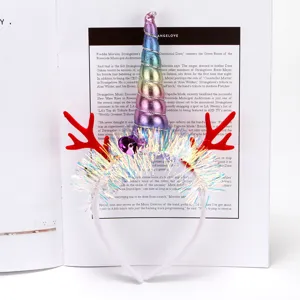 Festive Christmas glowing unicorn headband with red antlers and iridescent tinsel details.