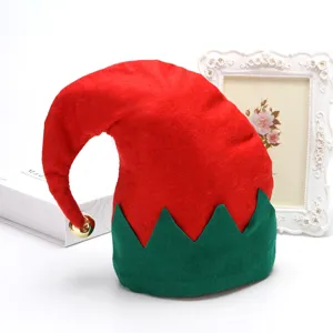 Detailed view of a red and green Christmas elf hat with a gold bell and festive decor.