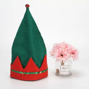 Close-up of a festive red and green Christmas elf hat featuring small golden bells decoration