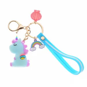 Kawaii blue silicone unicorn keychain with rainbow and shell charms for girl's bag