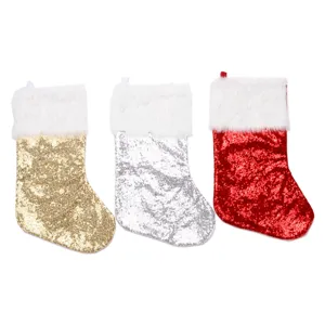 Set of three festive glitter sequin Christmas stockings in gold silver and red colors