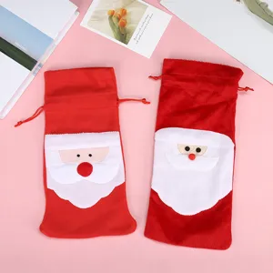 Detailed view of the Santa Claus face design on plush red festive wine bottle covers