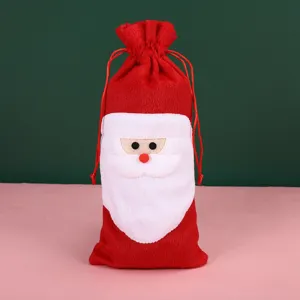 Detailed close-up of a festive red plush Santa Claus Christmas wine bottle gift bag