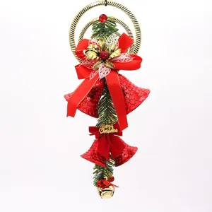 Festive red Christmas bell ornament with green pine needles and gold hanging ring