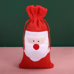 Detailed front view of a red felt Santa Claus drawstring wine bottle gift bag decor