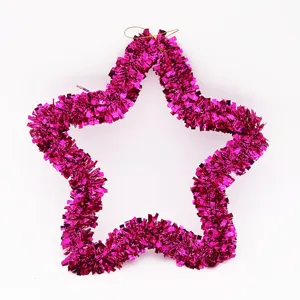 Macro view of a 35cm star-shaped Christmas decoration in shimmering pink tinsel