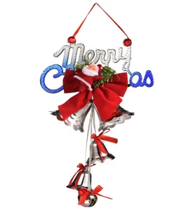 Detail of Christmas hanging ornament featuring Santa Claus, red bow, and silver bells.