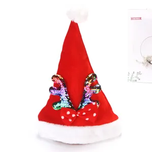 Gorro de Papá Noel de terciopelo rojo con astas de lentejuelas y detalle de lazo de lunares