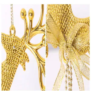 Macro detail of a golden reindeer Christmas tree ornament with beaded surface and bow
