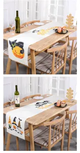 Detailansicht eines Halloween-Tischläufers aus Leinen mit Kürbis-Design
