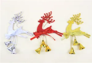 Detailed view of three glittery reindeer Christmas ornaments with bows and bells