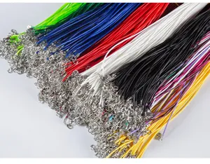 Close-up of colorful waxed cord necklace strings with silver lobster clasps for DIY