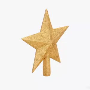 Gold glittery five-pointed star Christmas tree topper decoration on white background