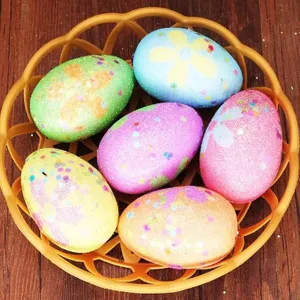 Set of six colorful speckled foam Easter eggs in a decorative small orange basket