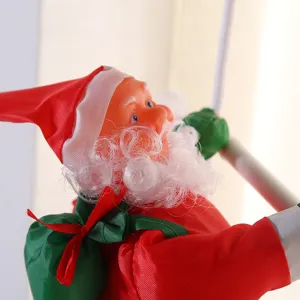 Close-up detail of a climbing Santa Claus Christmas hanging decoration in red suit