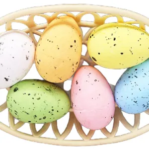Colorful speckled foam Easter eggs in a beige basket for festive holiday decoration