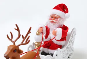 Electric musical Santa Claus toy riding on a white sleigh pulled by a reindeer décor.