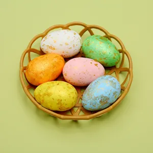 Close-up view of vibrant colorful DIY Easter eggs featuring elegant gold foil texture details