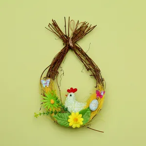 Close-up of Easter twig wreath featuring a charming hen, speckled egg, and floral decorations.
