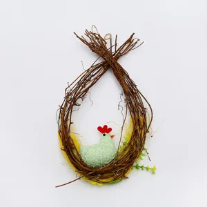 Close-up of an egg-shaped Easter twig wreath with a cute green hen figurine inside