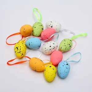 Close-up detail of colorful speckled foam Easter eggs with assorted hanging satin ribbons