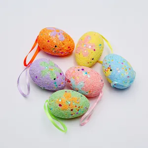 Macro view of colorful glitter foam Easter eggs with ribbons for festival decoration