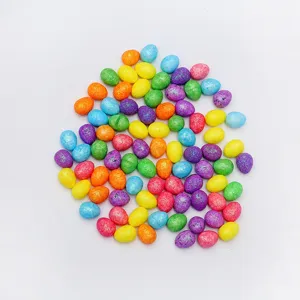 Detailed close-up view of vibrant colorful glitter mini Easter eggs for DIY decoration