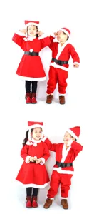 Two children wearing classic red Santa Claus costumes for Christmas holiday performances