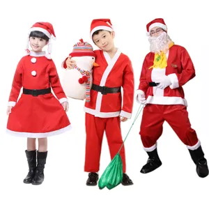 Group of family members wearing red velvet Santa Claus costumes for holiday events.
