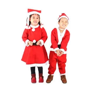 Detailed view of children wearing red Santa Claus costumes for holiday performances