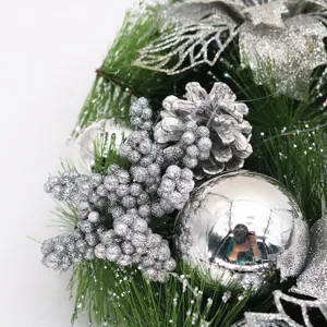 Macro detail of a 40cm silver Christmas wreath with pine cones and shiny ornaments
