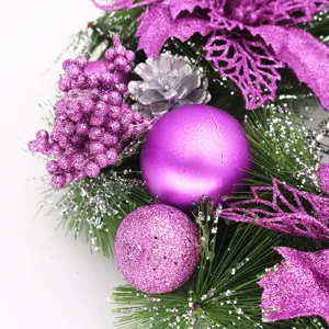 Detailed macro view of purple glitter baubles and leaves on Christmas wreath decor