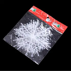 Detalle del adorno de copo de nieve blanco de 11 cm para el árbol de Navidad en su empaque