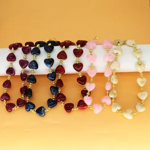 Vibrant retro marbled heart resin necklaces in multiple colors with elegant gold bead accents.