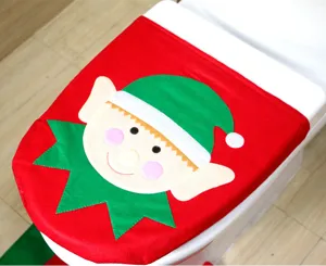 Close-up of a festive red and green Christmas elf toilet seat cover decoration.
