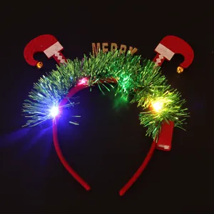 Detail view of LED Christmas elf feet headband with glowing tinsel and Merry sign