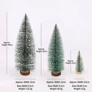 Groottevergelijking van drie mini bevroren dennen kerstbomen voor tafeldecoratie