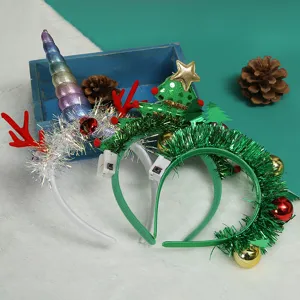 Detail shot of creative Christmas headbands with LED switches and festive decorations