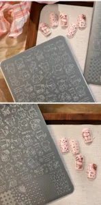 Macro detail of TG-029 nail art stamping plate featuring cute cat and star patterns