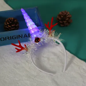 Detailed view of a glowing Christmas headband with reindeer antlers and unicorn horn