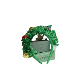 Creative green tinsel Christmas tree headband with festive ornaments for holiday party