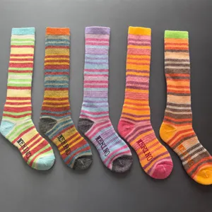 Women's Merino wool ski socks, thickened warm long striped thermal socks for outdoor sports.