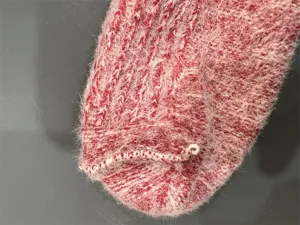 Wool sock fluffy detail texture close-up, cozy winter footwear fabric preview, soft knit.