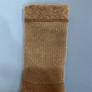 Merino wool sock knit detail showing breathable mesh texture and ribbed cuff construction.