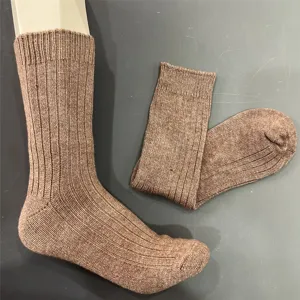 Close-up detail of ribbed knit merino wool winter mid-tube socks, soft texture and cozy fit.