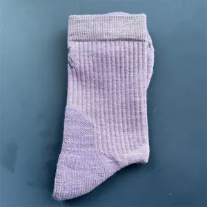 Detail view of the purple merino wool mid-tube hiking sports sock, showcasing ribbed cuff design.