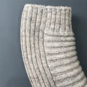 Close-up view of women's merino wool knit socks showing fine ribbed texture and detailed weaving.